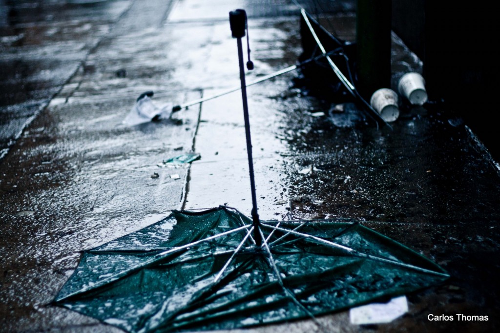 broken umbrellas in the wind.